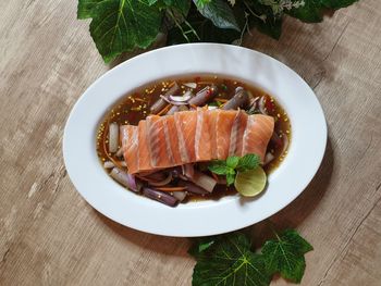 High angle view of fish in plate on table