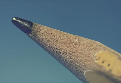 Low angle view of wood against clear sky