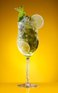 Close-up of wineglass against white background