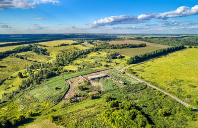 Scenic view of agricultural field against sky