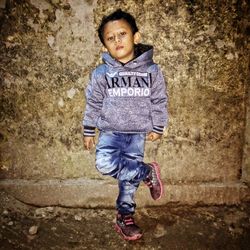 Portrait of boy standing outdoors