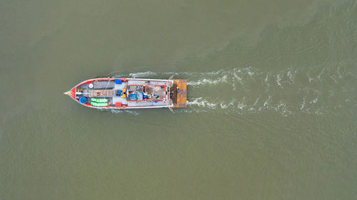 High angle view of ship sailing in sea