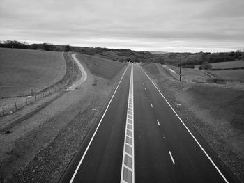 Empty road along landscape