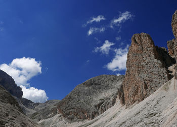 Scenic view of mountains against blue sky