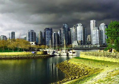 City skyline against cloudy sky