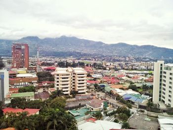 Cityscape with mountain range in background