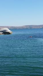 Scenic view of calm sea against clear sky