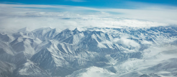 Scenic view of snowcapped mountains against sky