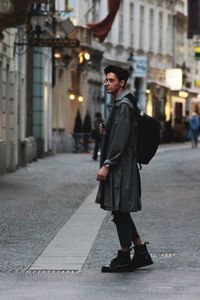 Man in city street at night