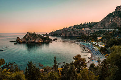 Scenic view of sea against clear sky during sunset