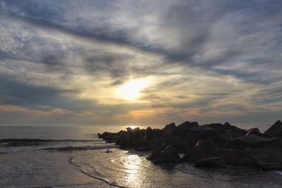 Scenic view of sea against cloudy sky