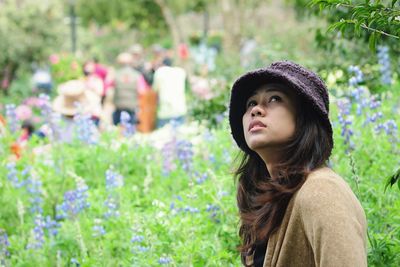 Beautiful young woman looking up