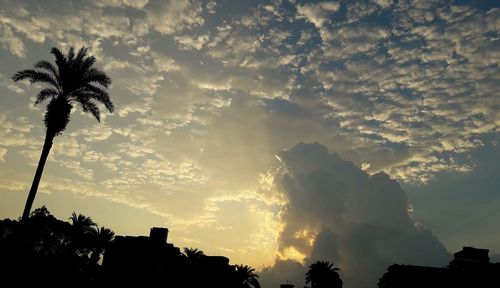 Low angle view of building against cloudy sky