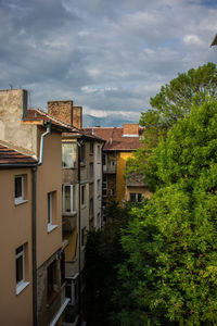 Buildings in town against sky