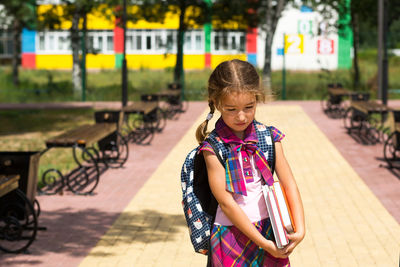 Cute girl standing outdoors