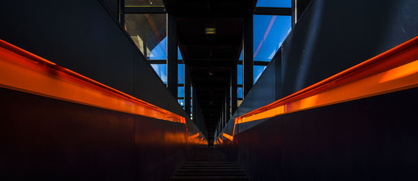 Low angle view of illuminated bridge against sky