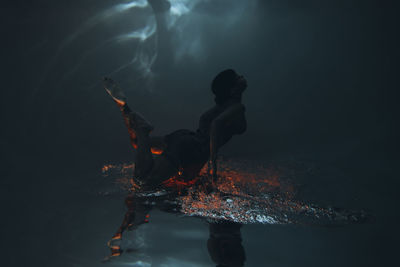 Young woman swimming underwater in sea