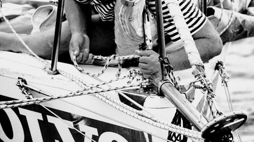 Low section of man holding bicycle