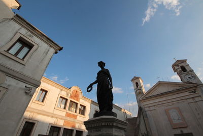 A female statue is located in front of teatro bernini is the performing arts theater,ariccia.