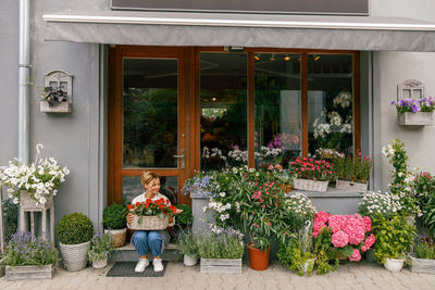 Potted plants in front of house