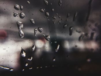Full frame shot of raindrops on glass window