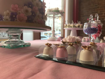 Close-up of wine glasses on table