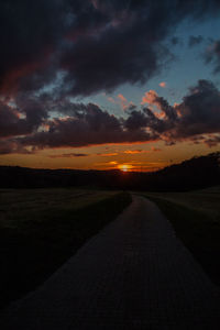 Scenic view of road against sky during sunset