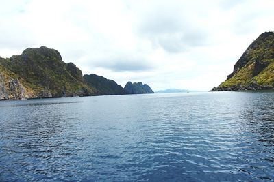 Scenic view of sea against cloudy sky