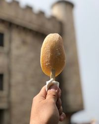 Close-up of hand holding ice cream