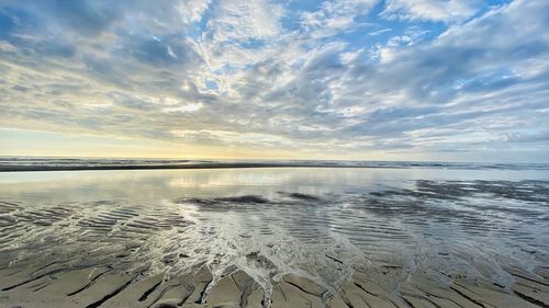 Scenic view of sea against sky at sunset