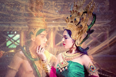 Close-up of romantic couple in traditional costume