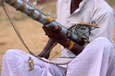 Close-up of man holding umbrella