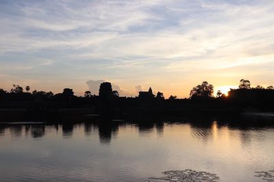 Scenic view of lake against sky during sunset