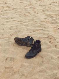 High angle view of shoes on sand