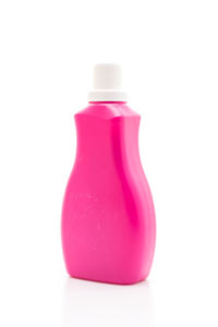 Close-up of pink bottle against white background