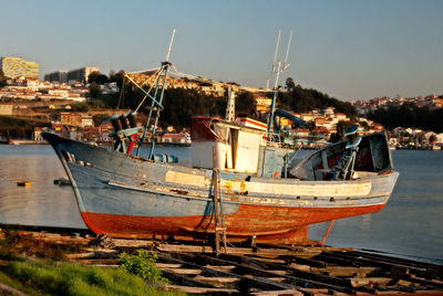 Boats moored at harbor