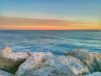 Scenic view of sea at sunset