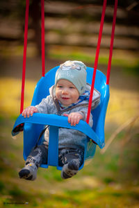 Portrait of boy smiling in playground