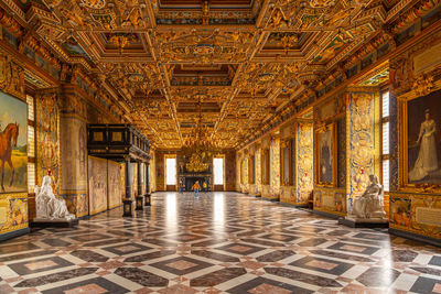 Tourists are visiting the grand knight's hall of the frederiksborg castle. interior 