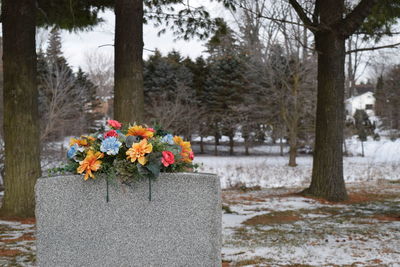 Flower bouquet on tombstone