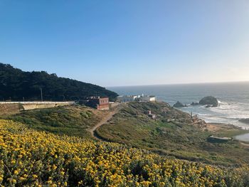 Scenic view of sea against clear blue sky