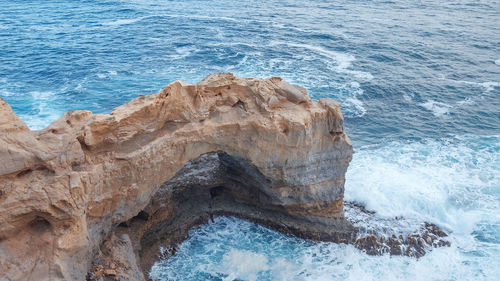 High angle view of rock formations on shore