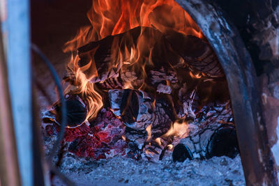 Close-up of bonfire on log