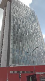 Low angle view of office building against sky