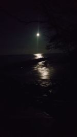 Scenic view of sea against sky at night