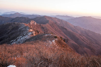 Scenic view of mountains against sky during sunset