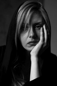 Close-up portrait of young woman at home