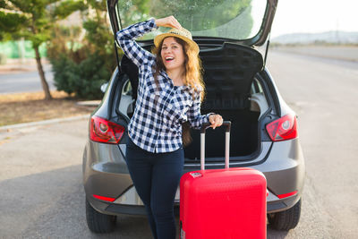 Portrait of happy woman in car