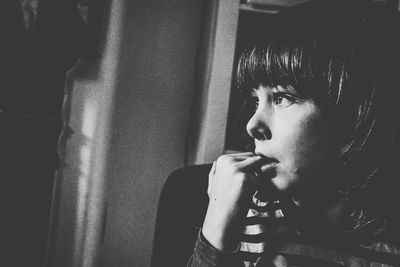 Close-up of thoughtful girl at home