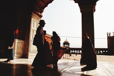 People in front of building